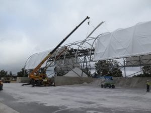 Fabric structure with overhead conveyor system